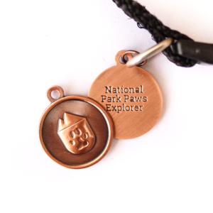 national park paws dog tag, light weight water proof in antique copper